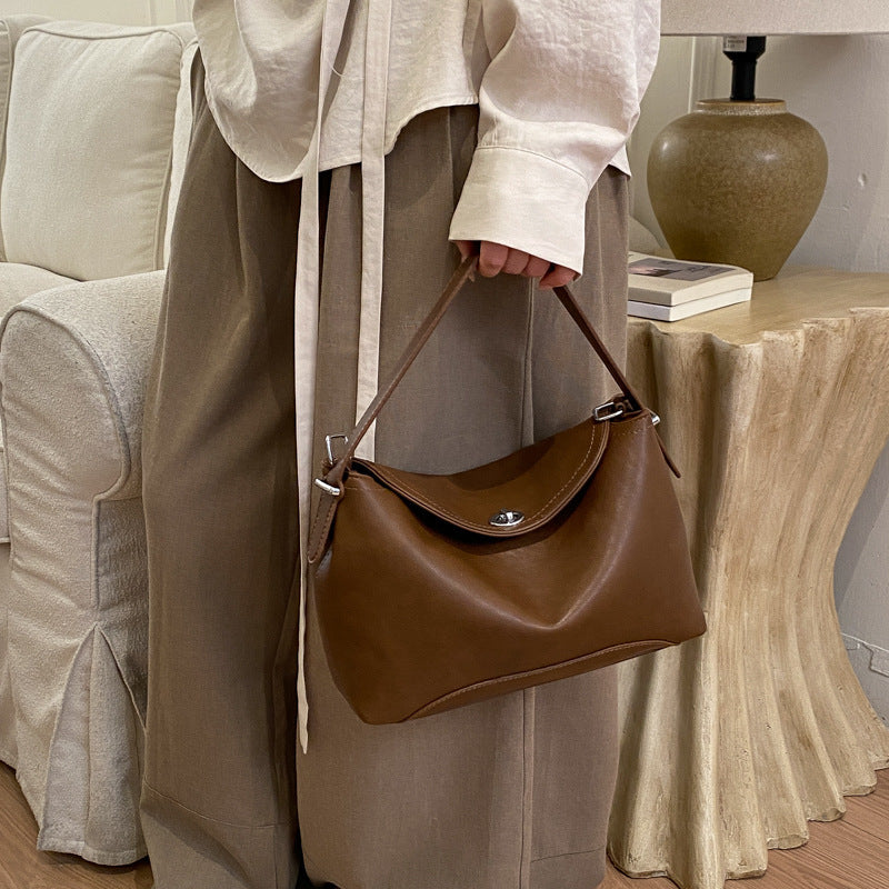 Women's handbag with flexible strap and elegant design