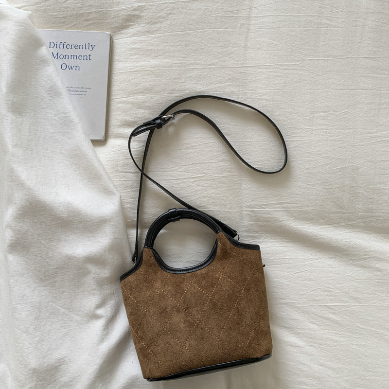 Ladies elegant handbag with high-quality suede and leather accents