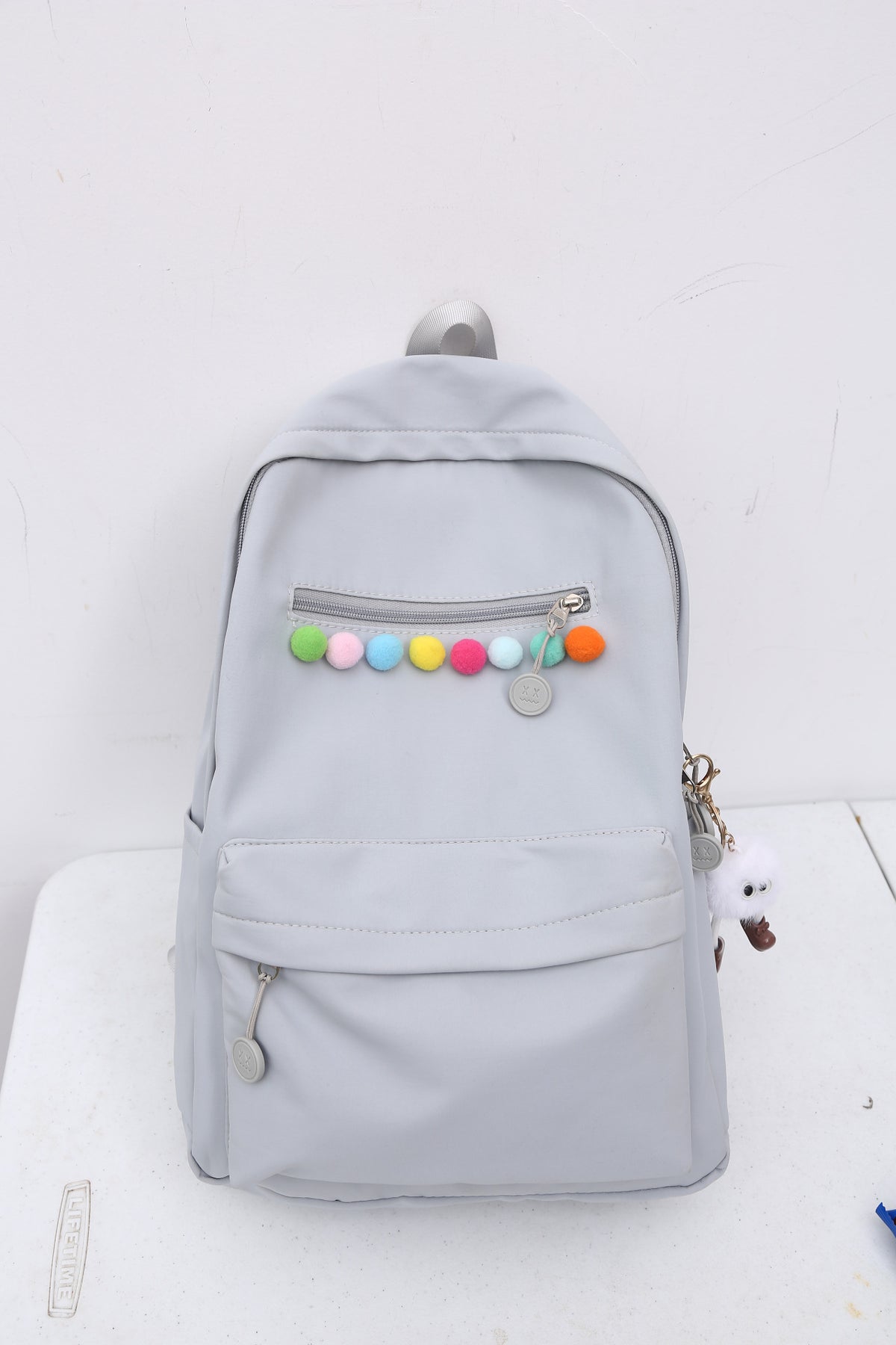 Practical backpack with colorful applications
