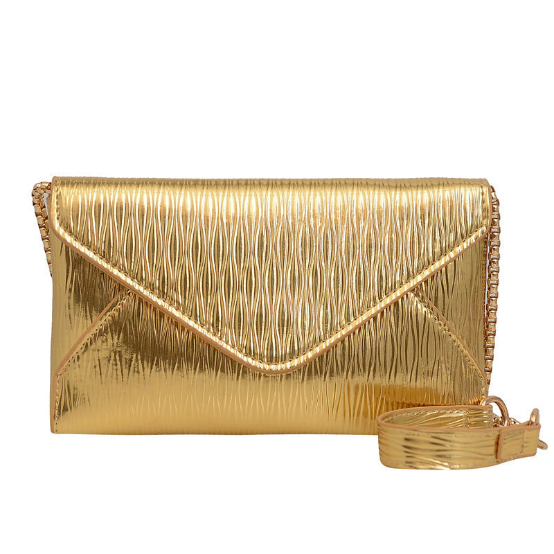 Women's elegant clutch with shiny upper material