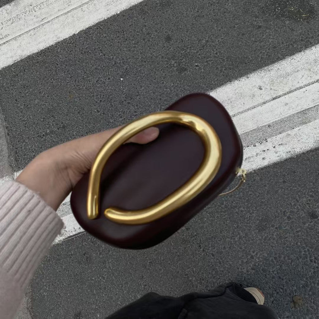 Statement Clutch with Sculptural Handle
