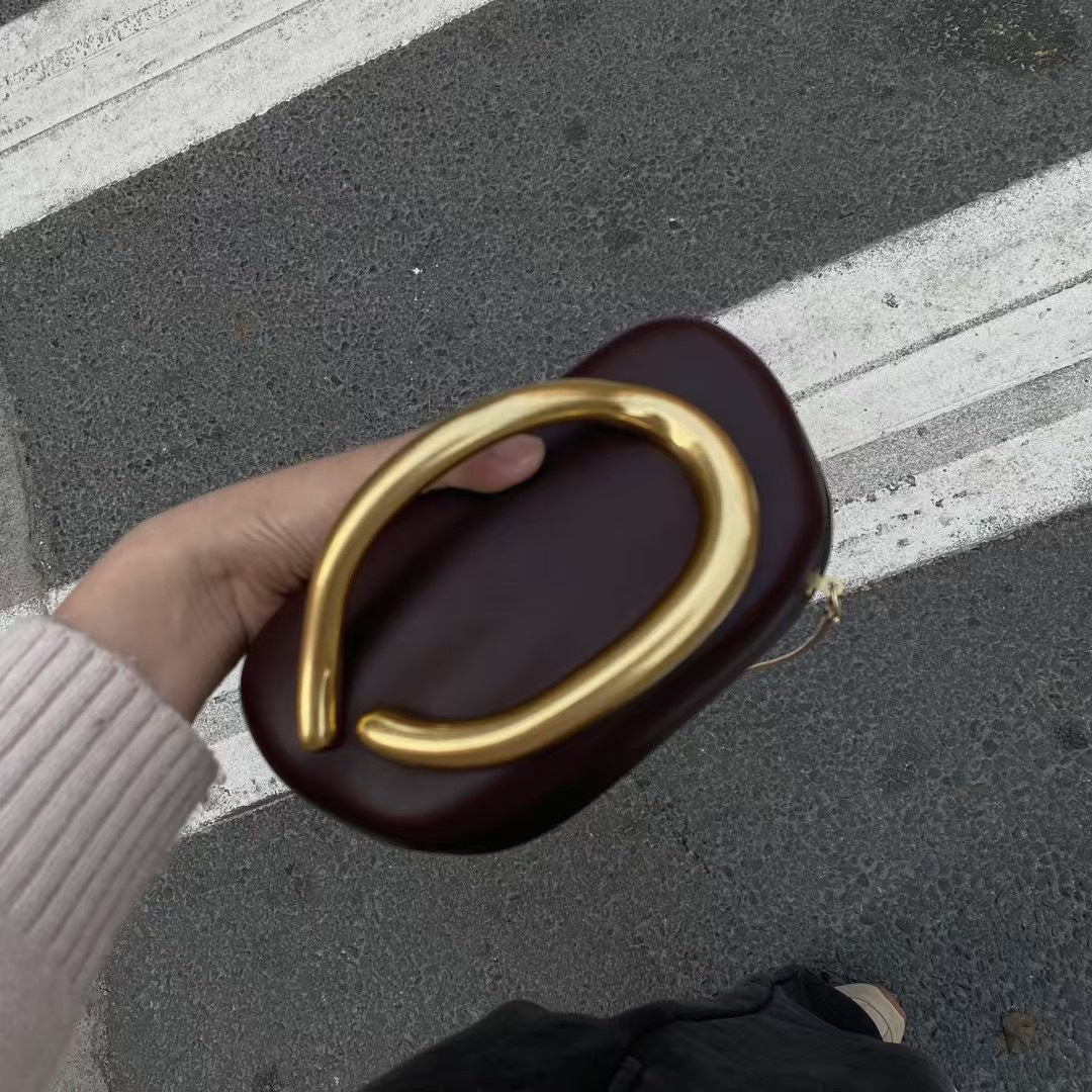 Statement Clutch with Sculptural Handle