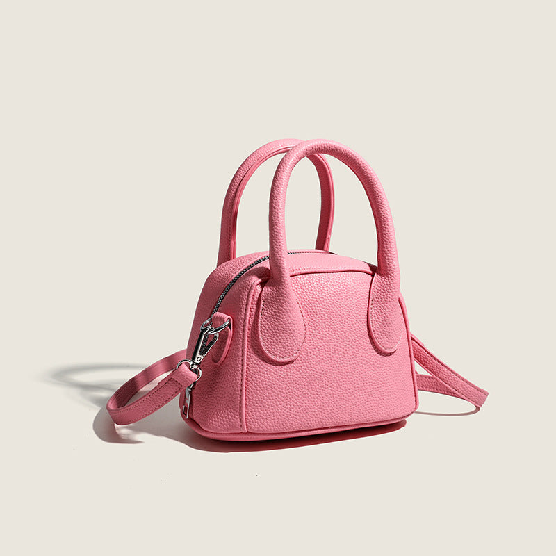 Women's mini handbag with structured exterior and detachable shoulder strap
