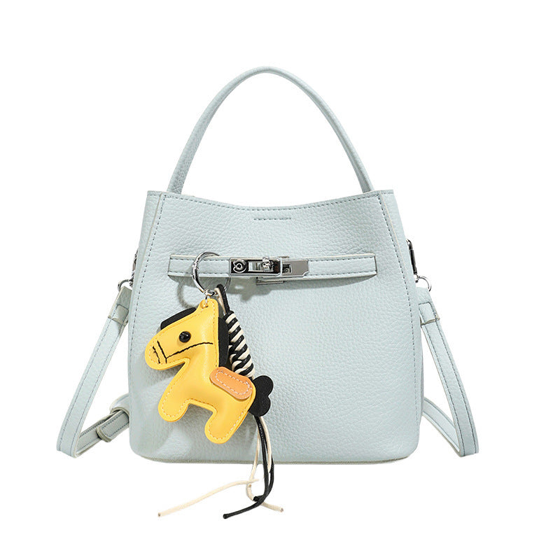 Women’s mini crossbody bag with playful design and cute charm
