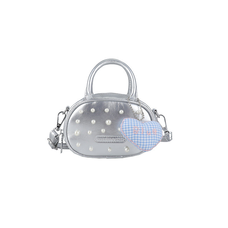 Ladies trendy mini handbag with striking pearl applications