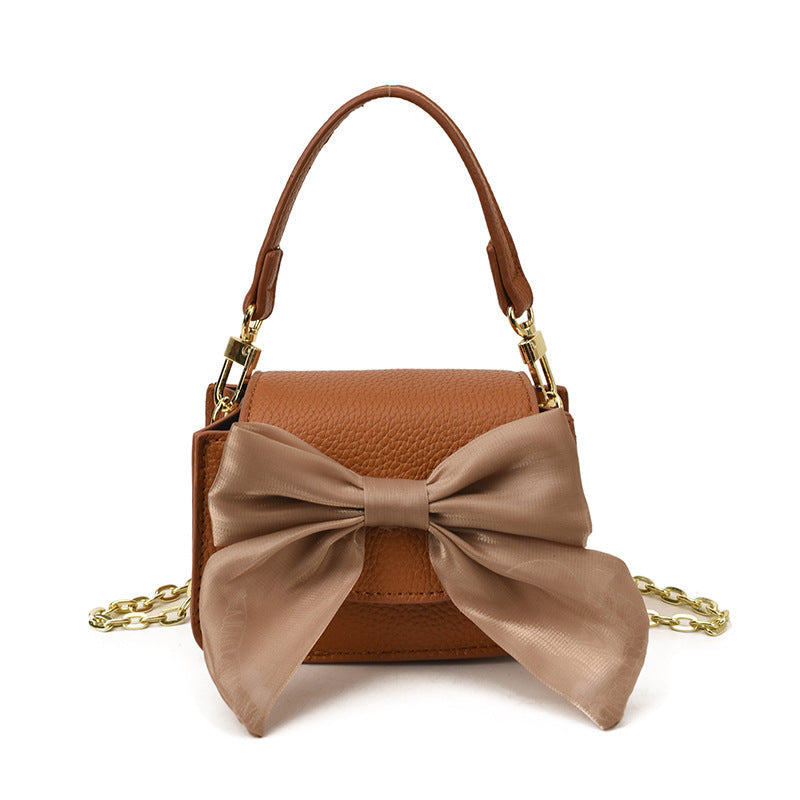 Ladies mini handbag with decorative bow design