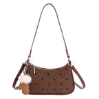 Ladies trendy mini handbag with playful animal charm