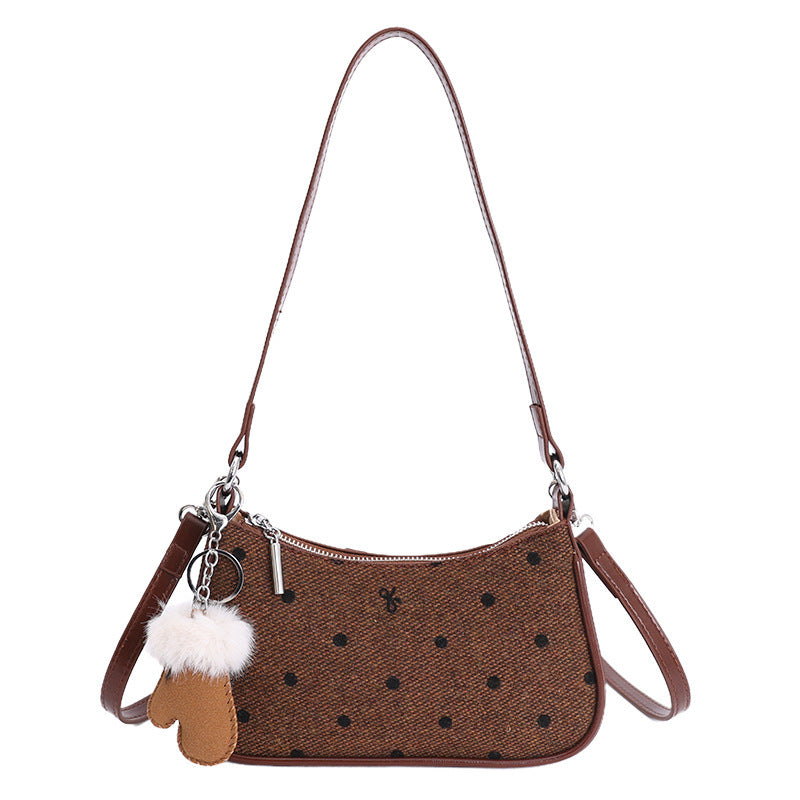 Ladies trendy mini handbag with playful animal charm