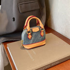 Women’s mini hobo bag made of textured synthetic leather with golden accents