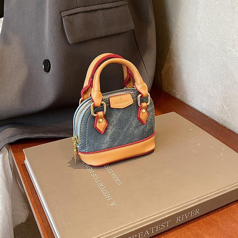 Women’s mini hobo bag made of textured synthetic leather with golden accents