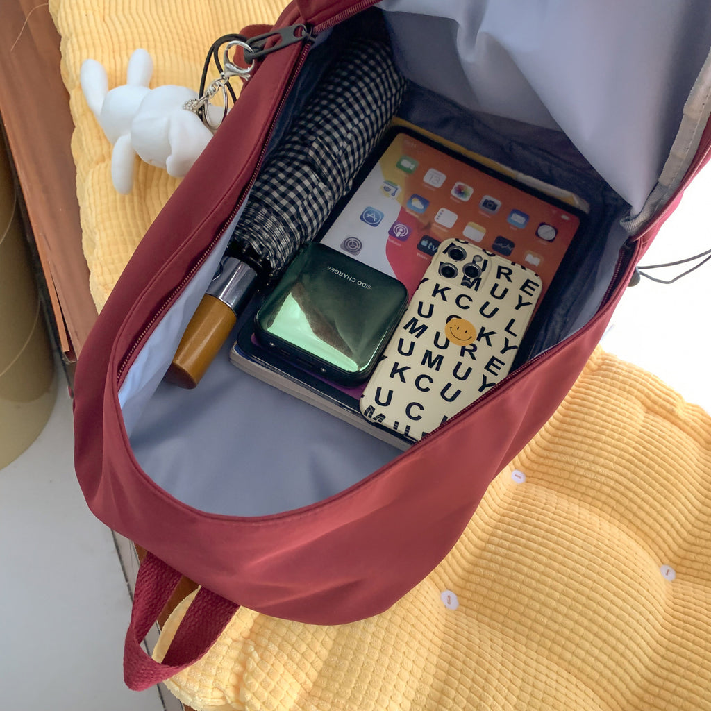 Multi-functional backpack with integrated keychain