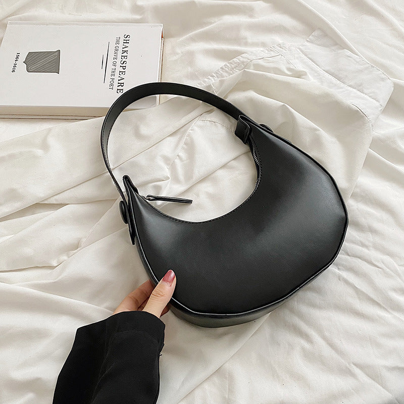 Women elegant shoulder bag with modern accents