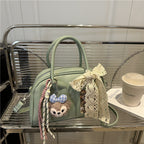 Ladies Mini Handbag with playful animal motif and charming charm