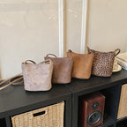 Women's mini bag made of soft suede with adjustable shoulder strap