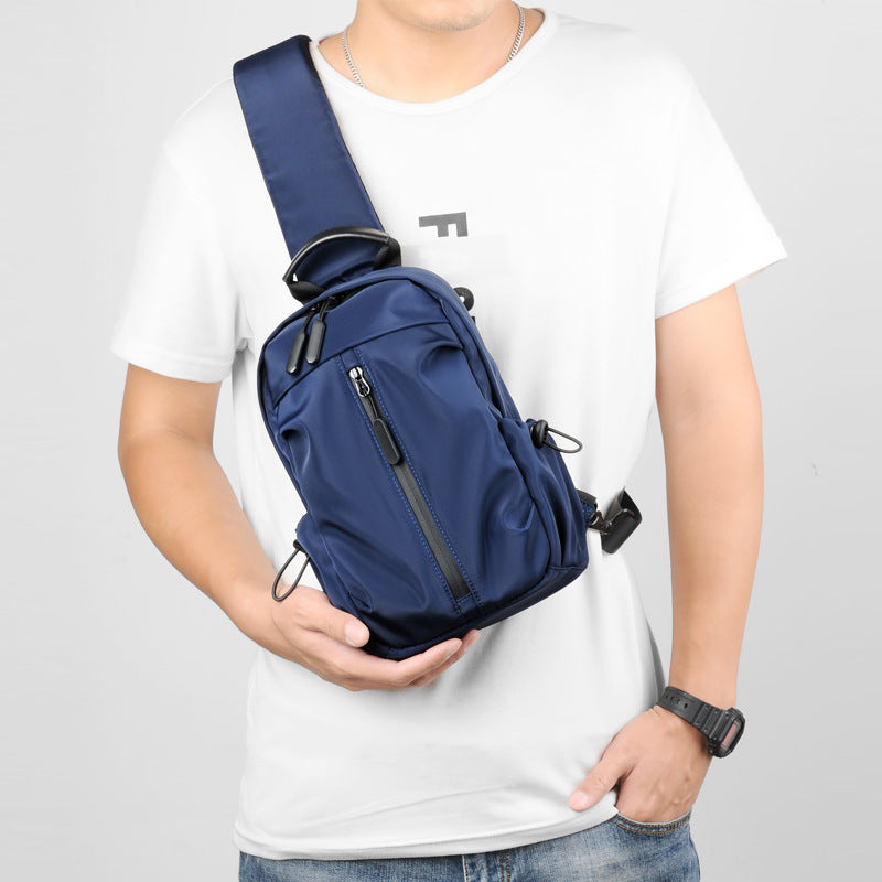 Sling backpack with multiple compartments