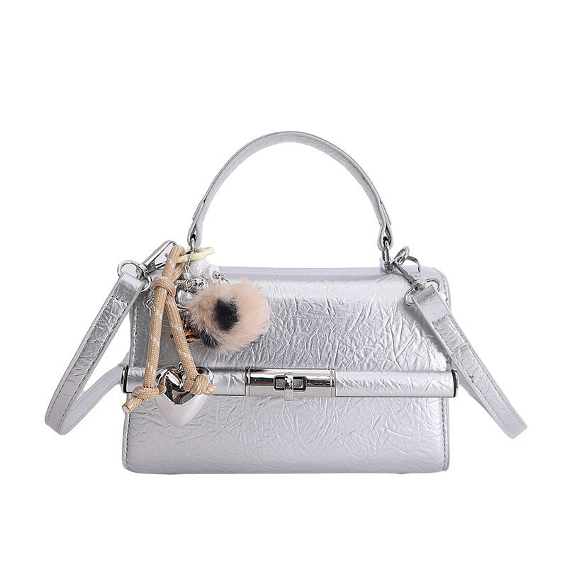 Women's mini crossbody bag with playful charm