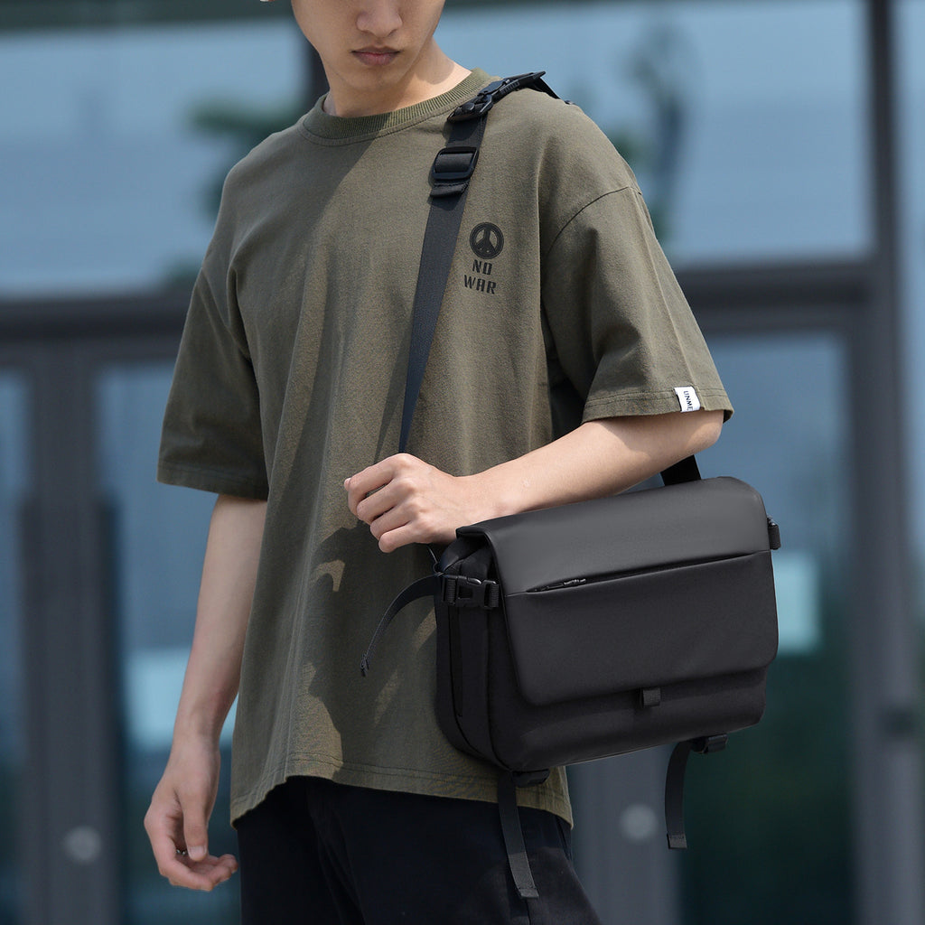 Messenger bag with versatile compartments and water-repellent material