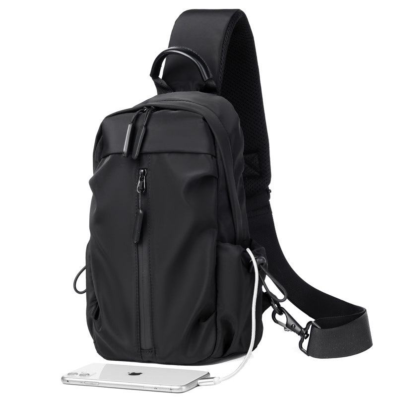 Sling backpack with multiple compartments