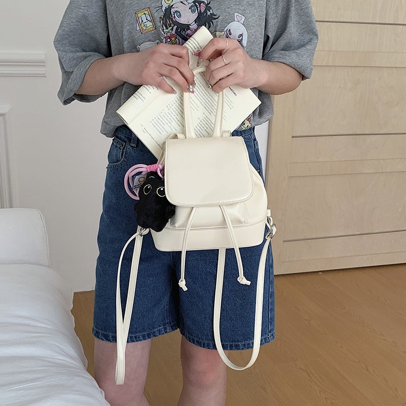 Women's mini backpack with playful pendant